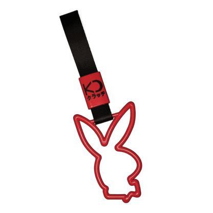 Red bunny drift charm or drift ring. Inspired by bus, train, and subway handles (or Tsurikawas) that were rebelliously repurposed for automotive decoration.